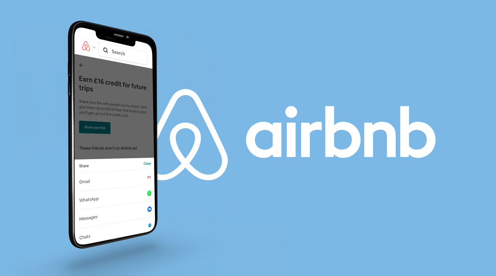 A smartphone with a mobile version of the Airbnb referral dashboard